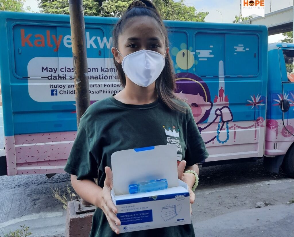 young girl holding health kits as part of health education
