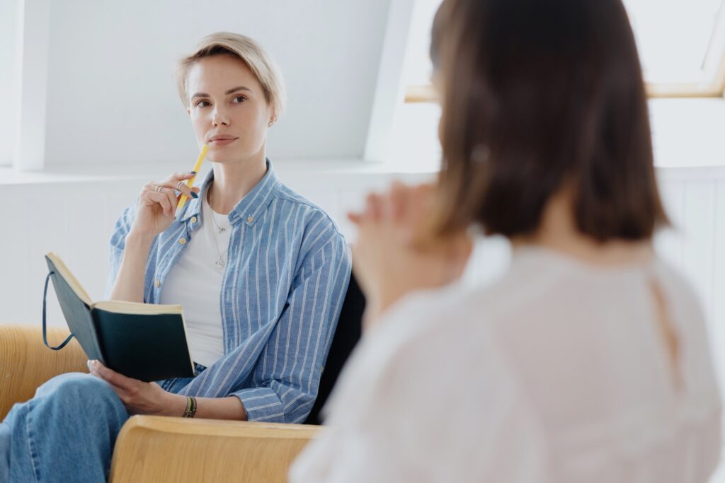 psychologist with a notebook and pen