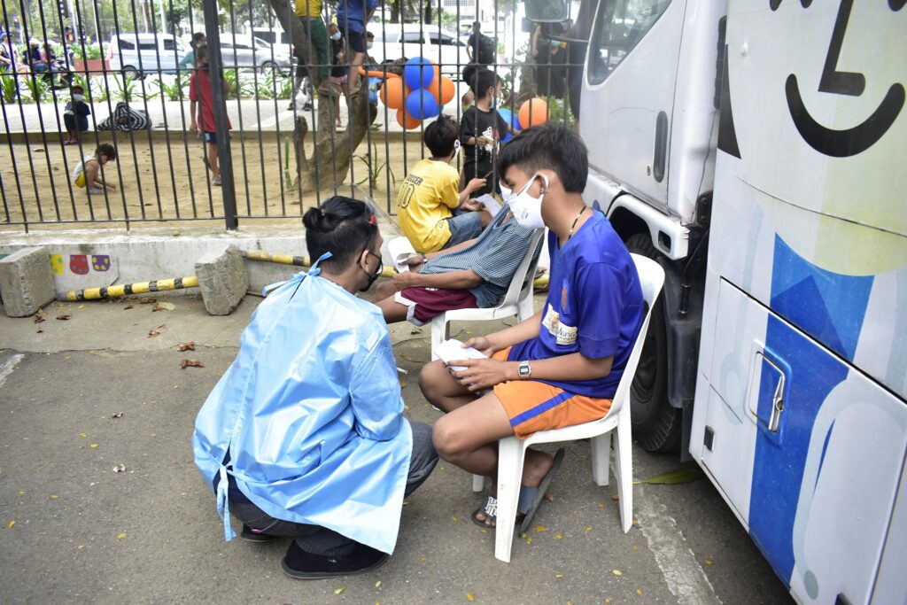 Childhope Philippines volunteer conducting health programs for children