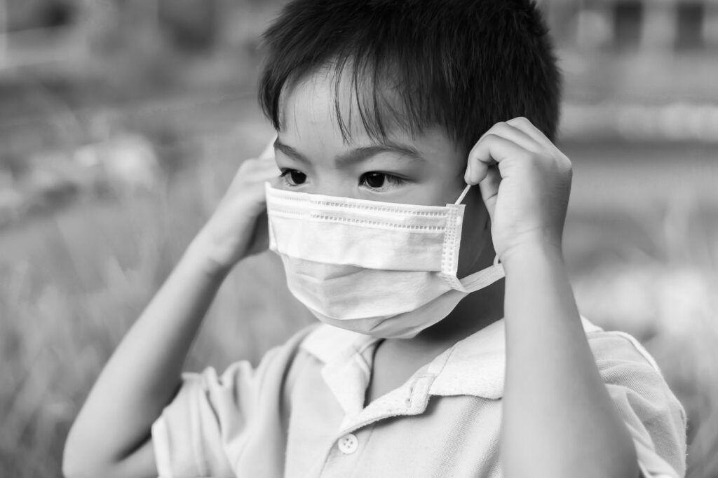 asian child wearing face mask