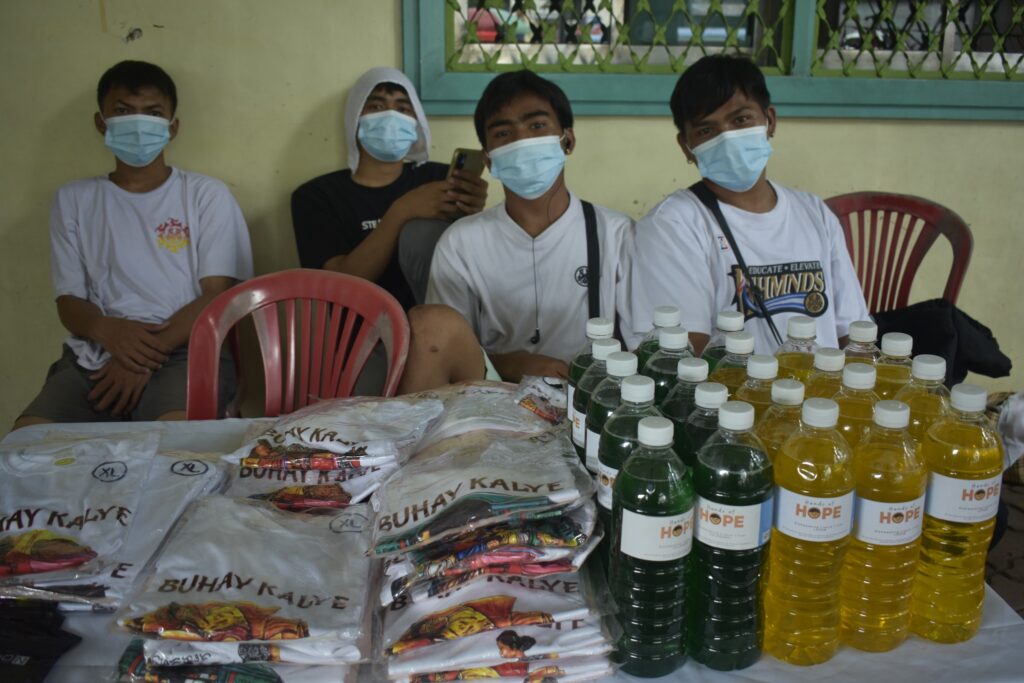 livelihood program project bamboo participants posing alongside their products