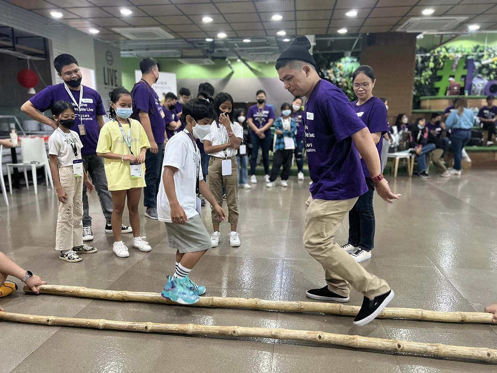 telus teaching children from childhope philippines to dance