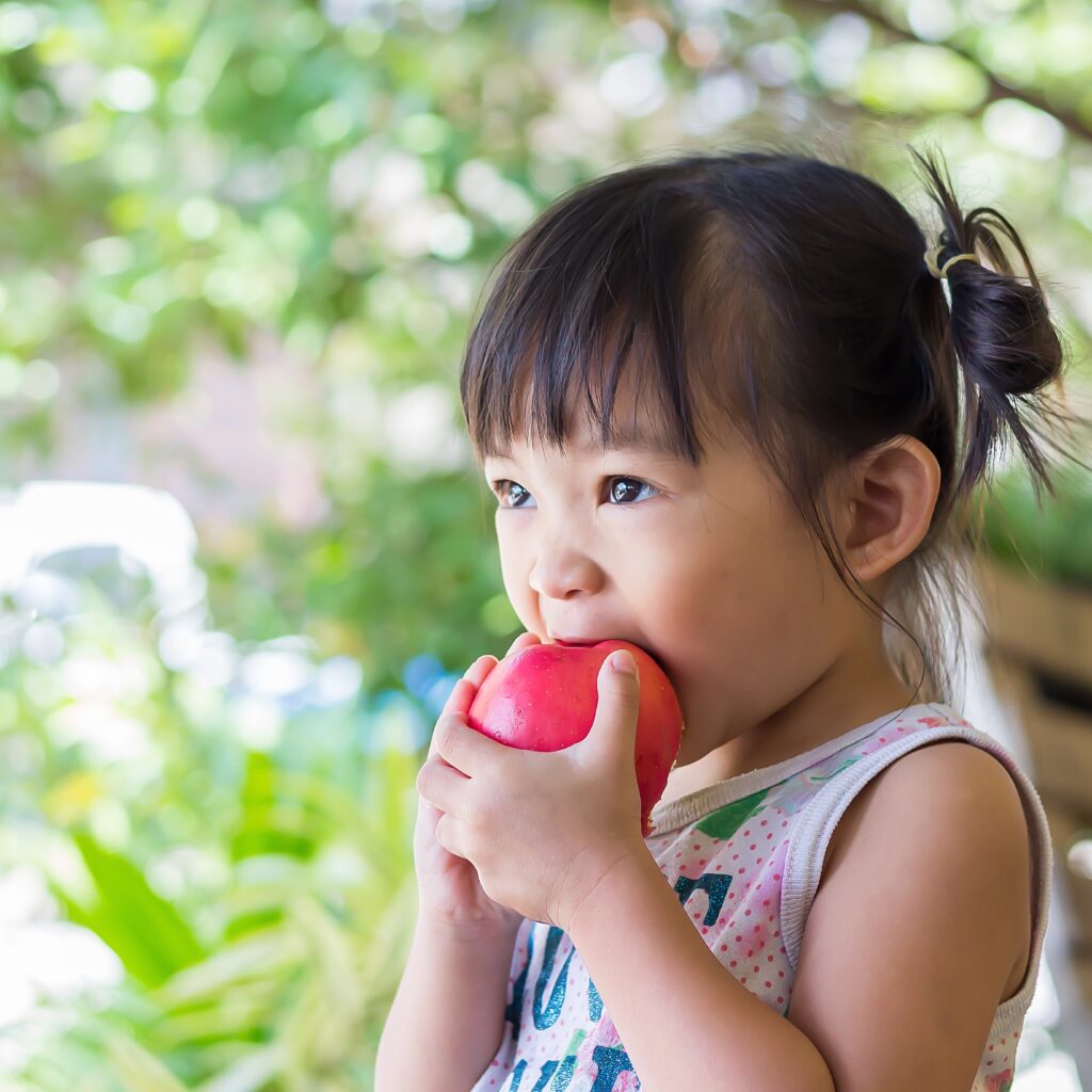 girl eating an apple