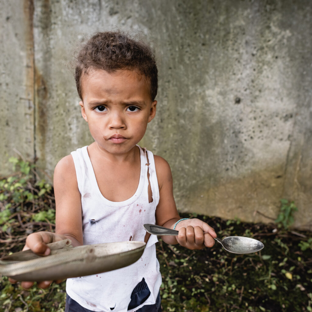 streetkid holding spoon and fork