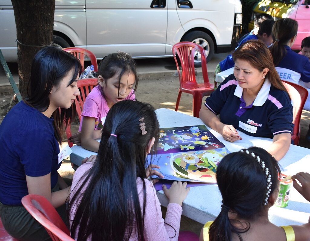 volunteers educating street children