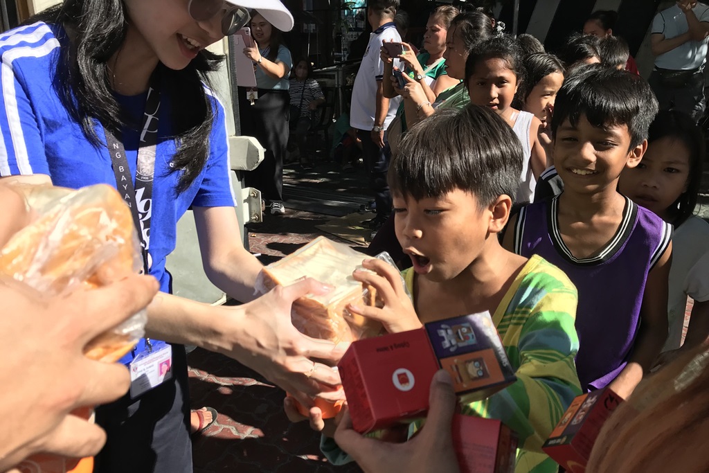 joyful child beaming with excitement after receiving a donation