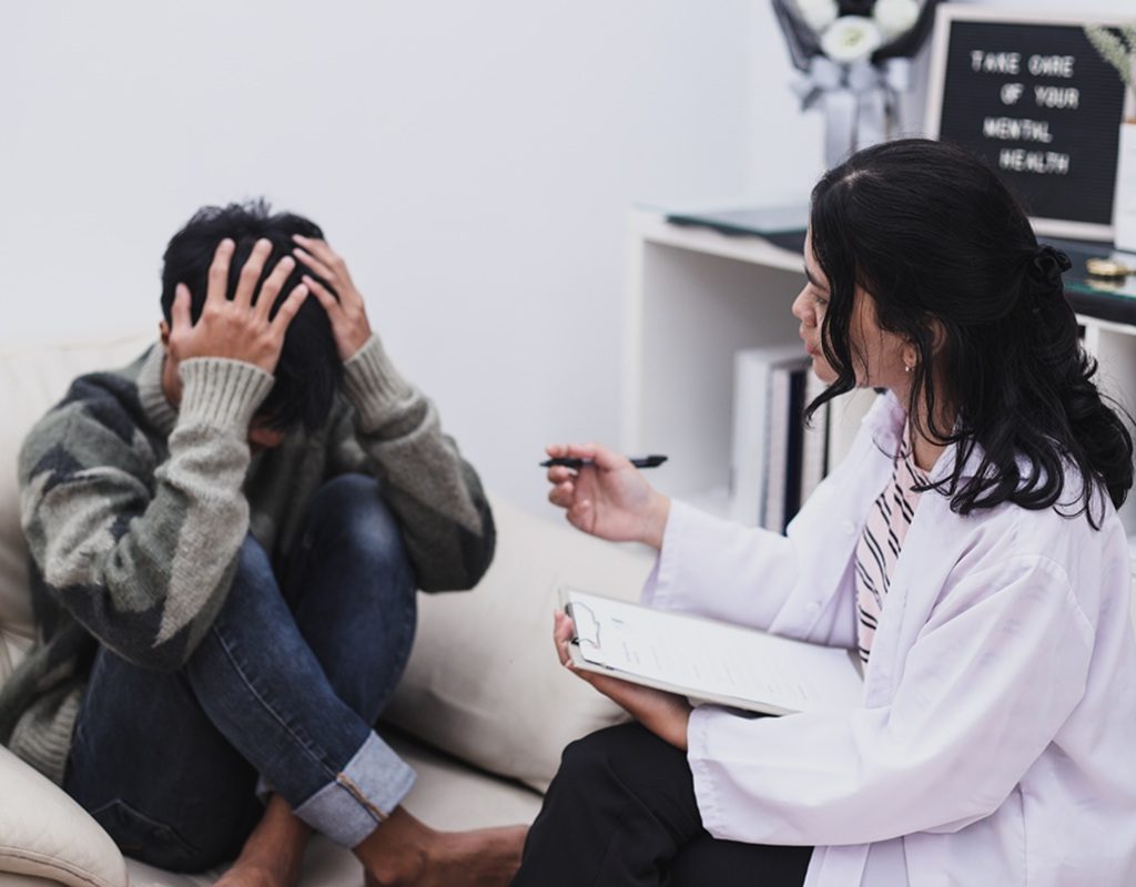 stress young man having therapy session for his mental health