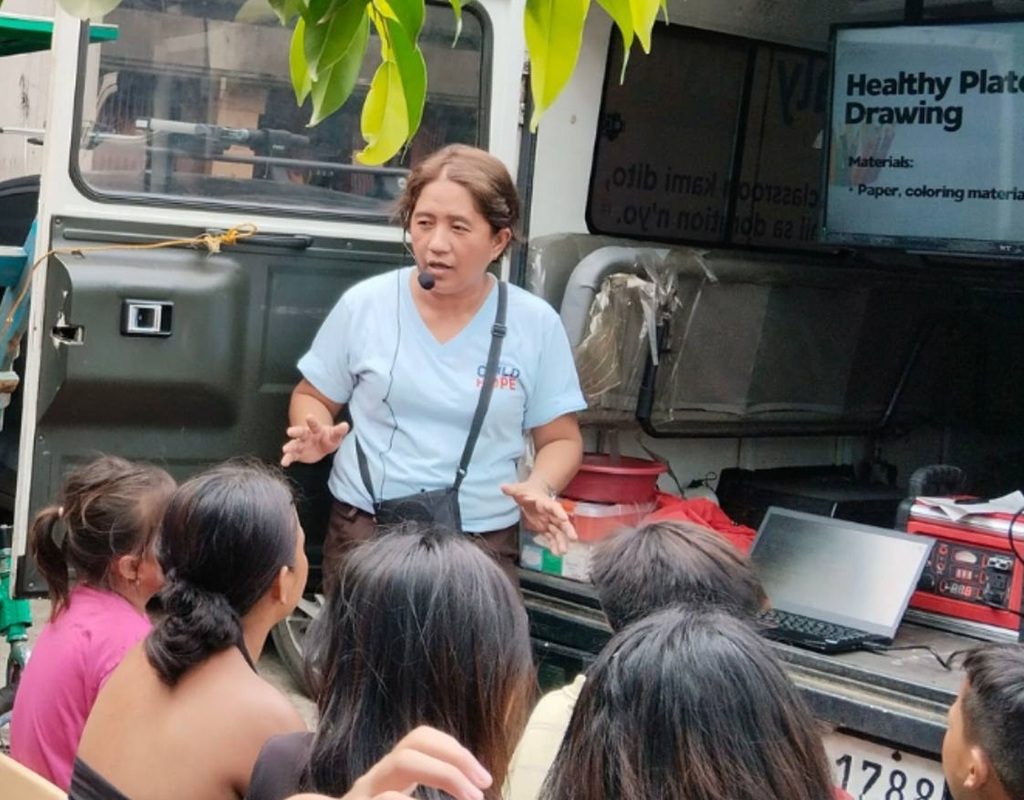 Childhope staff discussing personal hygiene for children