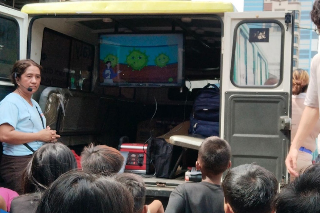 television screen showing cartoon illustration of germs