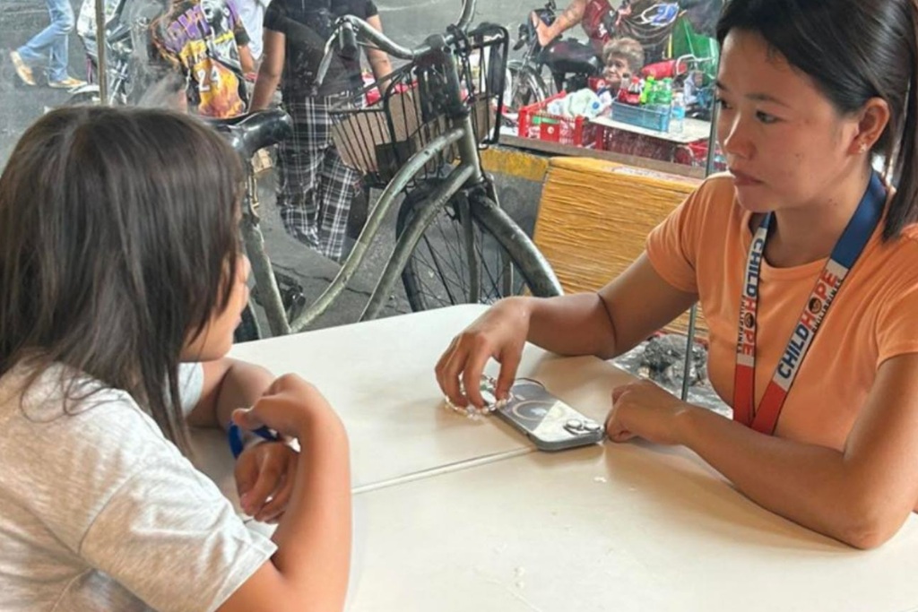 Childhope staff having a counseling session with a child