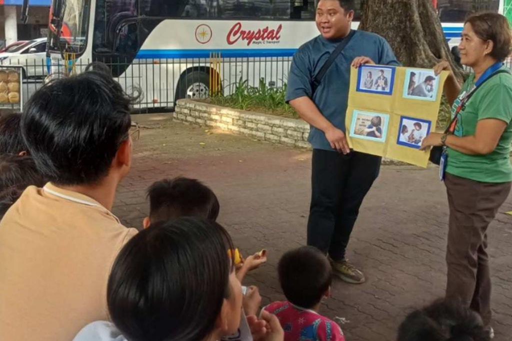 Childhope staff conducting educational activities with children on the street