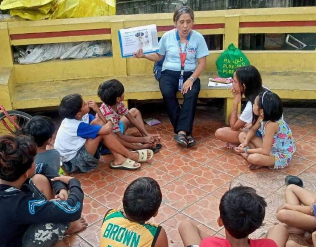 street educator teaching children during ational teachers month celebration