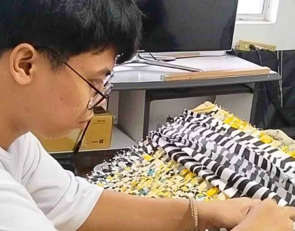 boy woving a simple rug